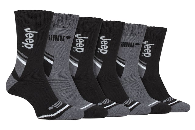 Jeep Men’s 6 Pack Performance Cotton Boot Socks: Introducing our 6 Pair Pack of Jeep Performance Poly Cotton Boot Socks for men. Crafted mainly from a superior blend of Polyester and Cotton, these socks are a perfect addition to your wardrobe, whether for work or leisure wear. Engineered for comfort and built to last, they transform your everyday boots into a comfortable, shock-absorbing haven for your feet. They also have breathable panels in the uppers for enhanced air circulation. These innovative panels ensure your feet stay cool and fresh, even after a long day's wear. With their stylish branded looks, these socks are woven with the utmost care. The natural softness of the cotton, combined with the premium and durable performance of the polyester, ensures they are not only soft but also long-lasting. Resilient and robust, these socks are lined with a terry looped pile from the cuff to the toe, providing full cushioning for your feet. A standout feature is the elasticated arch support band situated at the mid-foot. This not only gives the socks a secure hold on your foot but also offers gentle lift and support to the arch, facilitating improved foot comfort. These Jeep Socks are made from quality material consisting of 60% Polyester 38% Cotton 1% Elastodiene 1% Elastane and available in 6 different colours/styles. They are also Machine Washable. Extra Product Details: Jeep Thermal Boot Socks Performance Poly Blend Double Layered Ribbed Cuff Warm & Comfortable Terry Looped Cushioning  Arch Support Ideal For Winter Striped Marl Patterns 6 Styles/Colours Available Machine Washable