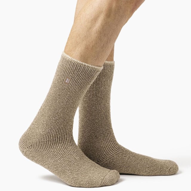 Heat Holders Men’s 2 Pack Merino Wool Thermal Socks: Ensure your feet stay snug and cosy even on the chilliest winter days with these top-notch Heat Holders thermal socks boasting a 2.9 TOG rating. Crafted with a blend of merino wool renowned for its exceptional heat retention and moisture-wicking abilities, these long thermal socks employ cutting-edge knitting technology unique to Heat Holders, guaranteeing unmatched warmth and comfort. Indulge in all-day warmth and comfort with these thermal socks featuring a longer looped pile and luxuriously soft brushed inner layer, designed to effectively trap heat and cushion your feet. . These men’s merino wool socks are available in 6 great colours: Black, Grey, Blue, Brown, Khaki, Oatmeal and are made from 54% Acrylic 36%, Wool, 5% Nylon, 4% Polyester, 1% Elastane. They are machine washable (on a gentle cycle) and are available in a two pair pack. Extra Product DetailsHeat Holders Merino Wool Socks 2 Pair Multi Pack Reinforced Heel & Toe Soft Merino Wool Soft Brushed Inner 2.9 TOG Rating Superior Warmth Men’s One Size: 6-11 UK Machine Wash Cold On Gentle Cycle