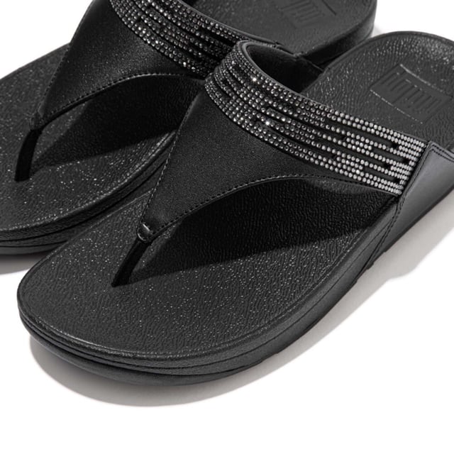 Women's Fit Flop Lulu Lasercrystal Leather Toe-Post Sandals in Black Womens Fit Flop Lulu Lasercrystal Leather Toe-Post Sandals in black.- Leather upper.- Slip on fastening.- Padded strap.- Microwobbleboard Standard Technology.- Slip-Resistant Rubber outsole.- Ref: EU3090