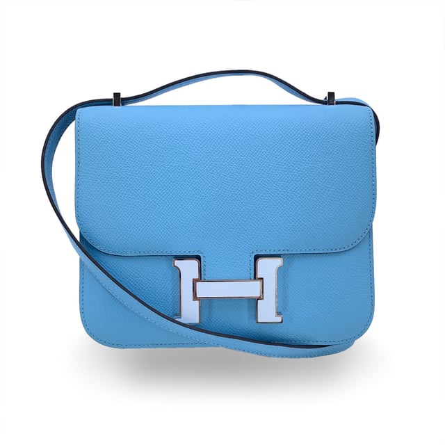 VINTAGE, RRP AS NEW
This beautiful Bag will come with a Certificate of ity provided by Entrupy, leading International Fashion ators. The certificate will be provided at no further cost  Hermès 'Constance 18' shoulder bag. This is a very iconic model by Hermes; legend has it that in 1967 Jean-Louis Dumas asked a designer to design a new bag model. The designer, who was pregnant, decided to give the bag the same name as her daughter, Constance. This model is crafted from light blue celeste Epsom leather with silver metal hardware. Flap with H clasp on the front enameled in white. Leather lining. 2 main sections inside. 3 side open pockets inside. The shoulder strap can be worn in two ways: longer or shorter, doubled. Mini mirror inside. 'HERMES Paris - Made in France' embossed under the flap. Condition Rating: A - EXCELLENTCondition Details: Minimal scratches on the rteverse of the flap. Hermes box and dustbag included. Please check the photos carefully and ask if you need to know more details or if you have any doubts.Measurements (cm):Depth: 3.8Height: 14.0Length: 17.8Other Details: Dustbag? YesKeys? NoBox? Yes Measurments:  width: 38 mm length: 178 mm height: 140 mm