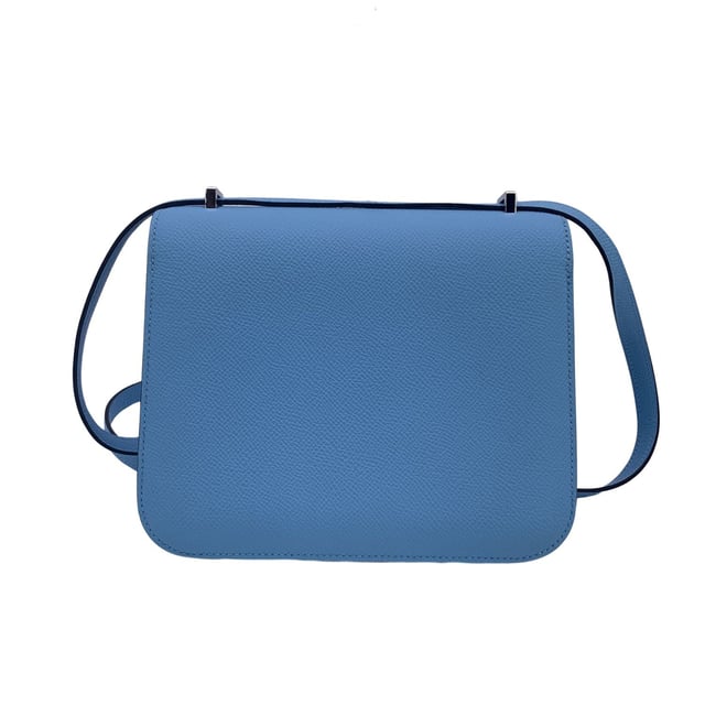 VINTAGE, RRP AS NEW
This beautiful Bag will come with a Certificate of ity provided by Entrupy, leading International Fashion ators. The certificate will be provided at no further cost  Hermès 'Constance 18' shoulder bag. This is a very iconic model by Hermes; legend has it that in 1967 Jean-Louis Dumas asked a designer to design a new bag model. The designer, who was pregnant, decided to give the bag the same name as her daughter, Constance. This model is crafted from light blue celeste Epsom leather with silver metal hardware. Flap with H clasp on the front enameled in white. Leather lining. 2 main sections inside. 3 side open pockets inside. The shoulder strap can be worn in two ways: longer or shorter, doubled. Mini mirror inside. 'HERMES Paris - Made in France' embossed under the flap. Condition Rating: A - EXCELLENTCondition Details: Minimal scratches on the rteverse of the flap. Hermes box and dustbag included. Please check the photos carefully and ask if you need to know more details or if you have any doubts.Measurements (cm):Depth: 3.8Height: 14.0Length: 17.8Other Details: Dustbag? YesKeys? NoBox? Yes Measurments:  width: 38 mm length: 178 mm height: 140 mm
