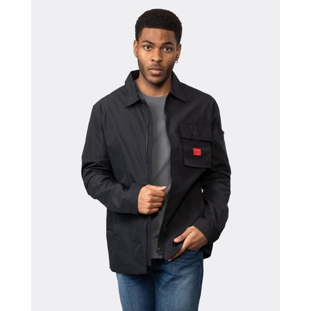 A trend-driven zip-up overshirt by HUGO Menswear in cotton-rich canvas, featuring a zipped pocket at the sleeve and a red logo label.
Regular fitCamp collarPatch chest pocketsSquared cuffs
75% Cotton, 25% Polyamide
50482701
 
 