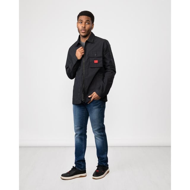 A trend-driven zip-up overshirt by HUGO Menswear in cotton-rich canvas, featuring a zipped pocket at the sleeve and a red logo label.
Regular fitCamp collarPatch chest pocketsSquared cuffs
75% Cotton, 25% Polyamide
50482701
 
 