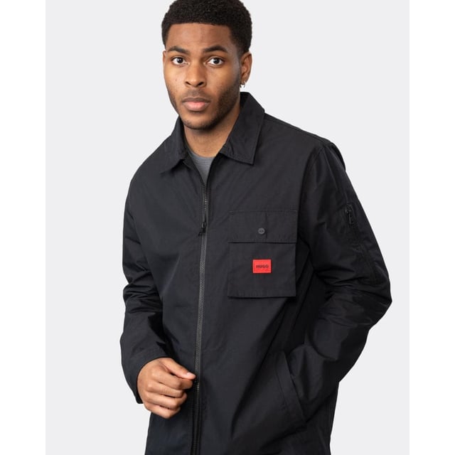 A trend-driven zip-up overshirt by HUGO Menswear in cotton-rich canvas, featuring a zipped pocket at the sleeve and a red logo label.
Regular fitCamp collarPatch chest pocketsSquared cuffs
75% Cotton, 25% Polyamide
50482701
 
 