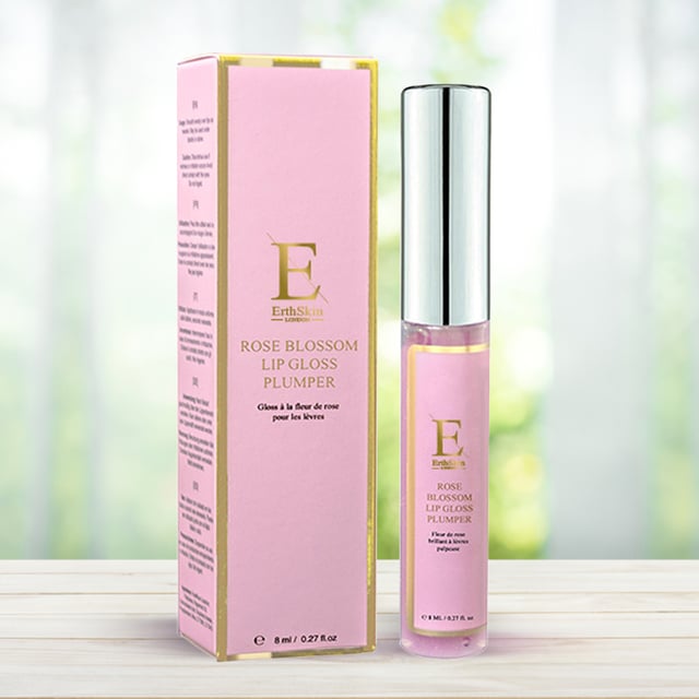 Rose Blossom Lip Gloss Plumper 8ml The Rose Blossom Lip Gloss Plumper is a luxurious lip treatment that combines the beauty of a gloss with the benefits of a plumper. Infused with nourishing rose extract, this lip gloss delivers a beautiful, natural shine while providing intense hydration to keep your lips soft and smooth. The plumping formula enhances the fullness of your lips, creating a fuller, more voluminous appearance without the need for invasive treatments. The delicate rose scent adds a touch of elegance, making each application a sensory delight.
