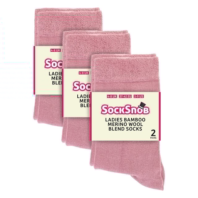 Sock Snob - 6 Pack Ladies Bamboo / Merino Wool Blend Socks: Sock Snob offers a luxurious blend of bamboo and Merino Wool in these Ladies' socks, delivering an exceptional combination of comfort, softness, and warmth. The bamboo fibres provide a silky-smooth feel against the skin, while their natural moisture-wicking properties keep your feet dry and fresh throughout the day. The Merino wool adds an extra layer of warmth, making these socks ideal for year-round wear, whether in the chill of winter or the mild temperatures of spring and autumn. These socks are perfect for everyday use, seamlessly transitioning from a busy day at the office to a relaxed evening at home, all while ensuring your feet remain cosy and comfortable. Whether you're dressing up or keeping it casual, these socks in various colours like Black, Brown, Rose Pink, Sage Green, Denim Blue, Burgundy, and Sand Beige will complement any outfit. They are designed to fit comfortably with Ladies Size 4-8 UK, and they are made from a soft and luxurious material blend: 60% Viscose (from Bamboo), 23% Polyamide, 15% Merino Wool, and 2% Elastane. These socks are also safely machine washable. Extra Product Details: Sock Snob Ladies Casual Socks Super Soft Feel Bamboo & Merino Wool Blend Naturally Moisture Wicking Simple & Plain Design Natural Warmth 6 Pairs Per Pack Ladies One Size: 4-8 UK Machine Washable