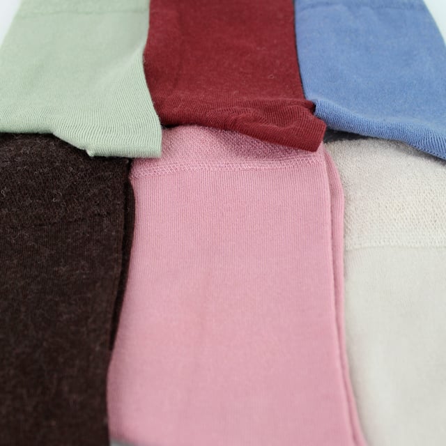 Sock Snob - 6 Pack Ladies Bamboo / Merino Wool Blend Socks: Sock Snob offers a luxurious blend of bamboo and Merino Wool in these Ladies' socks, delivering an exceptional combination of comfort, softness, and warmth. The bamboo fibres provide a silky-smooth feel against the skin, while their natural moisture-wicking properties keep your feet dry and fresh throughout the day. The Merino wool adds an extra layer of warmth, making these socks ideal for year-round wear, whether in the chill of winter or the mild temperatures of spring and autumn. These socks are perfect for everyday use, seamlessly transitioning from a busy day at the office to a relaxed evening at home, all while ensuring your feet remain cosy and comfortable. Whether you're dressing up or keeping it casual, these socks in various colours like Black, Brown, Rose Pink, Sage Green, Denim Blue, Burgundy, and Sand Beige will complement any outfit. They are designed to fit comfortably with Ladies Size 4-8 UK, and they are made from a soft and luxurious material blend: 60% Viscose (from Bamboo), 23% Polyamide, 15% Merino Wool, and 2% Elastane. These socks are also safely machine washable. Extra Product Details: Sock Snob Ladies Casual Socks Super Soft Feel Bamboo & Merino Wool Blend Naturally Moisture Wicking Simple & Plain Design Natural Warmth 6 Pairs Per Pack Ladies One Size: 4-8 UK Machine Washable