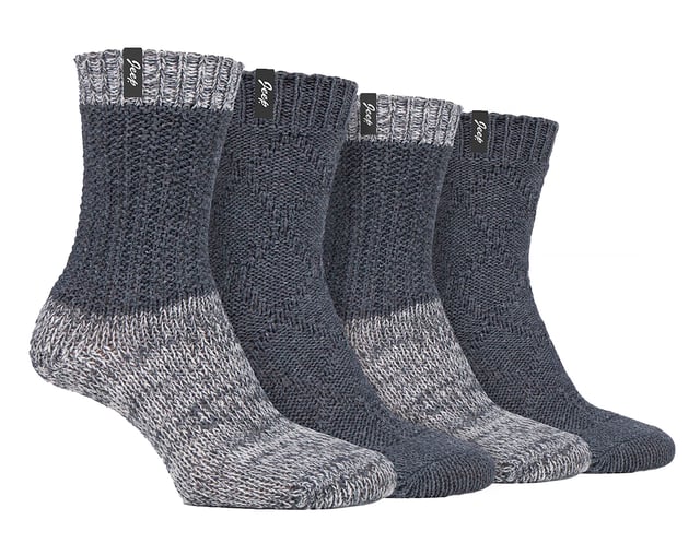 Jeep Ladies 4 Pack Cable Knit Boot Socks: Introducing our Jeep Wool Blend Cable Knit Boot Socks, a cosy and stylish addition to your outdoor and leisure wear. This 4 Pair Pack is designed for women seeking warmth, comfort, and durability in their ankle boots. Crafted from a luxurious blend of 58% Polyester, 26% Wool, 7% Acrylic, 4% Viscose, 4% Polyamide, and 1% Elastane, these socks offer a soft touch and natural warmth. The heavy-knit design and medium thickness ensure a chunky, rustic appearance with traditional knitwear patterns. One pair showcases a flat cable pattern with a diamond design, while the other features a thickly textured, moss stitch ribbed style, offering contrasting yet charming looks. Both pairs boast standard toe seams and crew leg length with lightly elasticated, ribbed cuffs for a comfortable fit. The sophisticated blend of wool, viscose, and synthetics delivers optimal warmth, breathability, durability, and softness for unparalleled comfort. Plus, the machine-washable material makes maintenance a breeze. Embrace winter with confidence and step out in style with our Jeep Wool Blend Cable Knit Boot Socks. Your feet will thank you for the cozy luxury and rugged elegance they provide. Extra Product Details: Cozy & stylish - Upgrade your outdoor wear with our Jeep Wool Blend Cable Knit Boot Socks. Warm & durable - Luxurious blend of wool, polyester, and more ensures natural warmth & lasting quality. Charming patterns - Enjoy flat cable and moss stitch designs for a rustic yet chic look. Comfortable fit - Crew leg length & lightly elasticated cuffs offer a snug feel. Optimal warmth & breathability - Sophisticated blend for unmatched comfort in chilly weather. Easy maintenance - Machine-washable material for convenient care. Rugged elegance - Embrace winter confidently with our stylish and durable boot socks. Happy feet - Treat your feet to cosy luxury and thank them with comfort all day long.