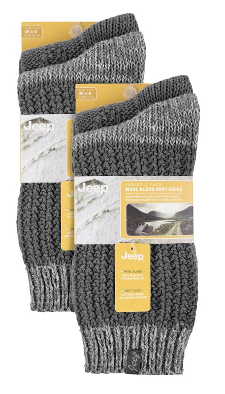 Jeep Ladies 4 Pack Cable Knit Boot Socks: Introducing our Jeep Wool Blend Cable Knit Boot Socks, a cosy and stylish addition to your outdoor and leisure wear. This 4 Pair Pack is designed for women seeking warmth, comfort, and durability in their ankle boots. Crafted from a luxurious blend of 58% Polyester, 26% Wool, 7% Acrylic, 4% Viscose, 4% Polyamide, and 1% Elastane, these socks offer a soft touch and natural warmth. The heavy-knit design and medium thickness ensure a chunky, rustic appearance with traditional knitwear patterns. One pair showcases a flat cable pattern with a diamond design, while the other features a thickly textured, moss stitch ribbed style, offering contrasting yet charming looks. Both pairs boast standard toe seams and crew leg length with lightly elasticated, ribbed cuffs for a comfortable fit. The sophisticated blend of wool, viscose, and synthetics delivers optimal warmth, breathability, durability, and softness for unparalleled comfort. Plus, the machine-washable material makes maintenance a breeze. Embrace winter with confidence and step out in style with our Jeep Wool Blend Cable Knit Boot Socks. Your feet will thank you for the cozy luxury and rugged elegance they provide. Extra Product Details: Cozy & stylish - Upgrade your outdoor wear with our Jeep Wool Blend Cable Knit Boot Socks. Warm & durable - Luxurious blend of wool, polyester, and more ensures natural warmth & lasting quality. Charming patterns - Enjoy flat cable and moss stitch designs for a rustic yet chic look. Comfortable fit - Crew leg length & lightly elasticated cuffs offer a snug feel. Optimal warmth & breathability - Sophisticated blend for unmatched comfort in chilly weather. Easy maintenance - Machine-washable material for convenient care. Rugged elegance - Embrace winter confidently with our stylish and durable boot socks. Happy feet - Treat your feet to cosy luxury and thank them with comfort all day long.