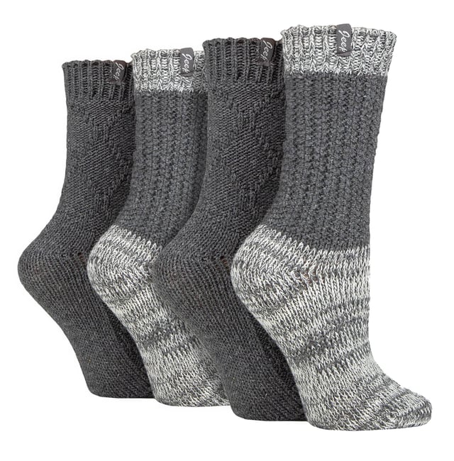 Jeep Ladies 4 Pack Cable Knit Boot Socks: Introducing our Jeep Wool Blend Cable Knit Boot Socks, a cosy and stylish addition to your outdoor and leisure wear. This 4 Pair Pack is designed for women seeking warmth, comfort, and durability in their ankle boots. Crafted from a luxurious blend of 58% Polyester, 26% Wool, 7% Acrylic, 4% Viscose, 4% Polyamide, and 1% Elastane, these socks offer a soft touch and natural warmth. The heavy-knit design and medium thickness ensure a chunky, rustic appearance with traditional knitwear patterns. One pair showcases a flat cable pattern with a diamond design, while the other features a thickly textured, moss stitch ribbed style, offering contrasting yet charming looks. Both pairs boast standard toe seams and crew leg length with lightly elasticated, ribbed cuffs for a comfortable fit. The sophisticated blend of wool, viscose, and synthetics delivers optimal warmth, breathability, durability, and softness for unparalleled comfort. Plus, the machine-washable material makes maintenance a breeze. Embrace winter with confidence and step out in style with our Jeep Wool Blend Cable Knit Boot Socks. Your feet will thank you for the cozy luxury and rugged elegance they provide. Extra Product Details: Cozy & stylish - Upgrade your outdoor wear with our Jeep Wool Blend Cable Knit Boot Socks. Warm & durable - Luxurious blend of wool, polyester, and more ensures natural warmth & lasting quality. Charming patterns - Enjoy flat cable and moss stitch designs for a rustic yet chic look. Comfortable fit - Crew leg length & lightly elasticated cuffs offer a snug feel. Optimal warmth & breathability - Sophisticated blend for unmatched comfort in chilly weather. Easy maintenance - Machine-washable material for convenient care. Rugged elegance - Embrace winter confidently with our stylish and durable boot socks. Happy feet - Treat your feet to cosy luxury and thank them with comfort all day long.