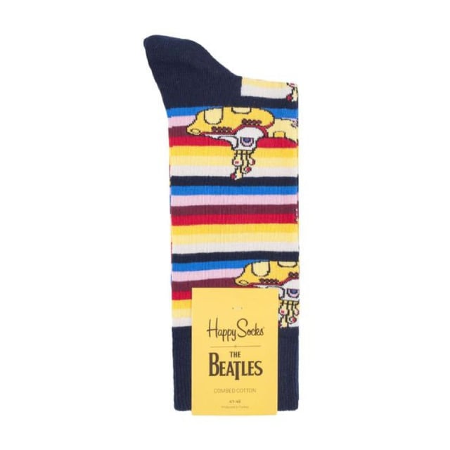 Happy Socks The Beatles Socks: Happy Socks are a popular brand providing a high-quality sock that combines unique designs and craftsmanship. Mikael Söderlindh and Viktor Tell had a vision to spread happiness by turning an everyday essential into a colorful design piece. In 2008, socks were just socks. White, grey and black pieces of textile that were nowhere close to the fashionable and creative design piece they could become. The world’s most comfortable and colorful tool for spreading happiness was born. This concept is now brought to life by Happy Socks’ talented team of creatives. Today, Happy Socks has reached 90 countries and every continent. With Concept Stores all around the world, from LA to Tokyo, Happy Socks can be found in over 10,000 top fashion apparel boutiques. Add a splash of colour and fun with these funky design Beatles Socks! Whether you're a fan of the Fab Four, or you're looking to purchase Beatles products for a loved one, there's something for everyone with our range of The Beatles Socks. The Yellow Submarine socks are striking in colour with their striped patterns. They come in a pack of 1 pair. They are machine washable at 40. They are made from 86% Cotton 12% Polyamide 2% Elastane. Extra Product details: - The Beatles Socks by Happy Socks - Yellow Submarine - Revolver Socks - Abbey Road Crossing - 1 Pair Pack - Machine washable at 40 - 86% Cotton 12% Polyamide 2% Elastane