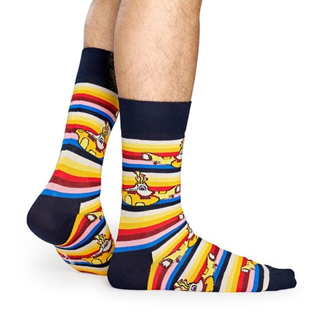 Happy Socks The Beatles Socks: Happy Socks are a popular brand providing a high-quality sock that combines unique designs and craftsmanship. Mikael Söderlindh and Viktor Tell had a vision to spread happiness by turning an everyday essential into a colorful design piece. In 2008, socks were just socks. White, grey and black pieces of textile that were nowhere close to the fashionable and creative design piece they could become. The world’s most comfortable and colorful tool for spreading happiness was born. This concept is now brought to life by Happy Socks’ talented team of creatives. Today, Happy Socks has reached 90 countries and every continent. With Concept Stores all around the world, from LA to Tokyo, Happy Socks can be found in over 10,000 top fashion apparel boutiques. Add a splash of colour and fun with these funky design Beatles Socks! Whether you're a fan of the Fab Four, or you're looking to purchase Beatles products for a loved one, there's something for everyone with our range of The Beatles Socks. The Yellow Submarine socks are striking in colour with their striped patterns. They come in a pack of 1 pair. They are machine washable at 40. They are made from 86% Cotton 12% Polyamide 2% Elastane. Extra Product details: - The Beatles Socks by Happy Socks - Yellow Submarine - Revolver Socks - Abbey Road Crossing - 1 Pair Pack - Machine washable at 40 - 86% Cotton 12% Polyamide 2% Elastane