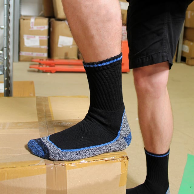 Bamboo Work Socks - Bulk Value Deal!: Looking for reliable work socks that can handle heavy-duty tasks? Look no further! These bamboo work socks offer exceptional value with their bulk pack of 12 pairs. . Designed with a thick piled bamboo cushioned foot bed, these socks provide unparalleled comfort, even during long periods of walking or standing. The viscose bamboo in the sole allows your feet to breathe and wicks away moisture, keeping your feet dry and odor-free. Perfect for steel toe capped boots and industrial boots, these work socks feature a reinforced heel and toe for added durability. The true heel and toe design prevents movement in shoes, ensuring a secure and comfortable fit. The reinforced terry loops and smooth toe seams further enhance comfort and longevity, especially when used with steel toe boots. Plus, they are cotton-rich for natural softness and ultimate comfort. Available in sizes 4-7, 6-11 & 12 14 UK. . Extra Product Details:: - Available in 2 sizes - Long-lasting and heavy-duty - Specifically designed for steel toe boots - Bamboo high pile sole for added comfort - True heel/toe design for improved fit - Anti-odor properties keep feet fresh - Cotton-rich for natural softness - Cushioned bamboo foot bed for extra comfort - Made from 55% cotton, 20% viscose (bamboo), 18% polyester, 4% nylon, and 3% elastane - Machine washable