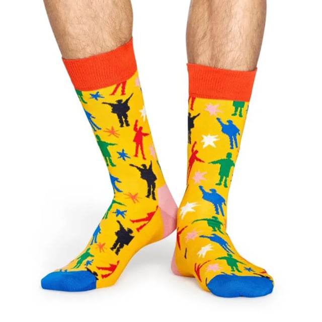 Happy Socks The Beatles Socks: Happy Socks are a popular brand providing a high-quality sock that combines unique designs and craftsmanship. Mikael Söderlindh and Viktor Tell had a vision to spread happiness by turning an everyday essential into a colorful design piece. In 2008, socks were just socks. White, grey and black pieces of textile that were nowhere close to the fashionable and creative design piece they could become. The world’s most comfortable and colorful tool for spreading happiness was born. This concept is now brought to life by Happy Socks’ talented team of creatives. Today, Happy Socks has reached 90 countries and every continent. With Concept Stores all around the world, from LA to Tokyo, Happy Socks can be found in over 10,000 top fashion apparel boutiques. Add a splash of colour and fun with these funky design Beatles Socks! Whether you're a fan of the Fab Four, or you're looking to purchase Beatles products for a loved one, there's something for everyone with our range of The Beatles Socks. The Yellow Submarine socks are striking in colour with their striped patterns. They come in a pack of 1 pair. They are machine washable at 40. They are made from 86% Cotton 12% Polyamide 2% Elastane. Extra Product details: - The Beatles Socks by Happy Socks - Yellow Submarine - Revolver Socks - Abbey Road Crossing - 1 Pair Pack - Machine washable at 40 - 86% Cotton 12% Polyamide 2% Elastane