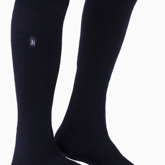 Heat Holders Mens 2 Pairs 1.6 TOG Lite Long Knee High Socks: Experience the pinnacle of warmth with the Heat Holders Men's 2 Pairs 1.6 TOG Lite Long Knee High Socks. Expertly engineered, these medium-thick thermal socks make a splendid addition to your wardrobe, providing unmatched warmth in all weathers. They are an essential addition for every man prioritising comfort during winter. Heat Holders socks are a masterstroke of thermal technology, offering an exceptional blend of warmth, comfort, and style. Equally suitable for indoor and outdoor activities, these socks seamlessly fit into your versatile lifestyle. Made with soft-brushed thermal yarn, these socks are an ideal fit for an all-round warmth experience. Heat Holders Men's 1.6 TOG Lite Long Knee High Socks hold a plethora of features. The unique thermal technology holds a timeless appeal while ensuring ongoing warmth. What's more, the medium-thick fabric gives a cosy feel and our TOG rated warmth assures top-level insulation keeping your feet warm and comfortable. Indulge in a perfect blend of warmth and style with Heat Holders- Your ultimate choice for premium thermal wear. Essential Product Details: - One pair in each pack - Standard toe seams and cuffs - Soft brushed thermal yarn - Heat Holders Technology - 1.6 TOG Rating - Perfect for both outdoors and comfy home-lounging - Range of Sizes Available - Machine Washable