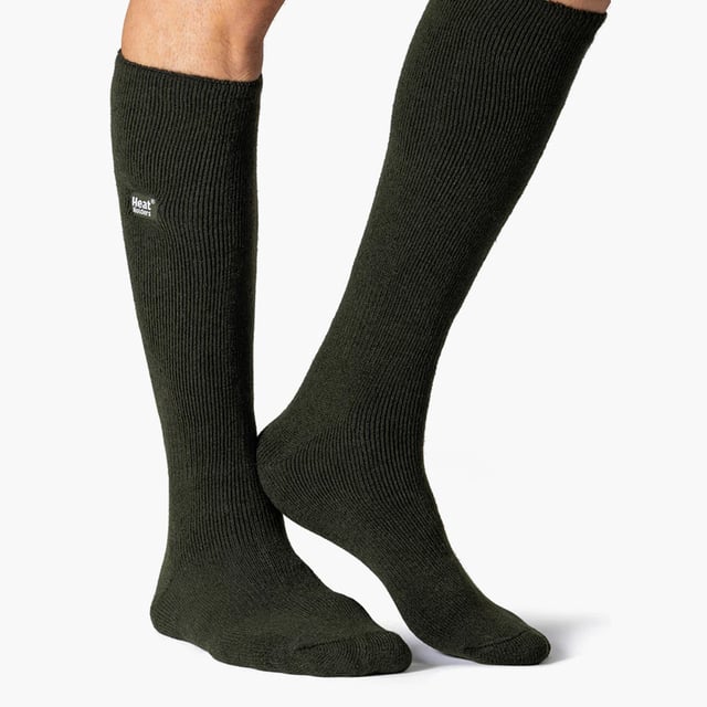 Heat Holders Mens 2 Pairs 1.6 TOG Lite Long Knee High Socks: Experience the pinnacle of warmth with the Heat Holders Men's 2 Pairs 1.6 TOG Lite Long Knee High Socks. Expertly engineered, these medium-thick thermal socks make a splendid addition to your wardrobe, providing unmatched warmth in all weathers. They are an essential addition for every man prioritising comfort during winter. Heat Holders socks are a masterstroke of thermal technology, offering an exceptional blend of warmth, comfort, and style. Equally suitable for indoor and outdoor activities, these socks seamlessly fit into your versatile lifestyle. Made with soft-brushed thermal yarn, these socks are an ideal fit for an all-round warmth experience. Heat Holders Men's 1.6 TOG Lite Long Knee High Socks hold a plethora of features. The unique thermal technology holds a timeless appeal while ensuring ongoing warmth. What's more, the medium-thick fabric gives a cosy feel and our TOG rated warmth assures top-level insulation keeping your feet warm and comfortable. Indulge in a perfect blend of warmth and style with Heat Holders- Your ultimate choice for premium thermal wear. Essential Product Details: - One pair in each pack - Standard toe seams and cuffs - Soft brushed thermal yarn - Heat Holders Technology - 1.6 TOG Rating - Perfect for both outdoors and comfy home-lounging - Range of Sizes Available - Machine Washable