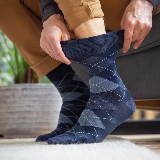 New Mens Gentle Grip Socks: With a specially designed HoneyComb Top, Sockshop soft Gentle Grip® Socks are made more comfortable for all wearers, but particularly if you struggle with circulatory problems or swollen legs, ankles and feet. This collection of designs look as good as they feel too, made from soft, comfortable cotton rich yarn. keep your feet odour free with flat seamed toes for extra wearability All SockShop Gentle Grip® Socks are constructed to care for your legs, comfortably moulding to their natural contours without leaving any of those ugly, irritating and itchy constriction rings. These really are the socks going forward for anyone who dislikes those tight tops. Gentle grip tops that do not fall down with wear and are ideal for diabetics too!