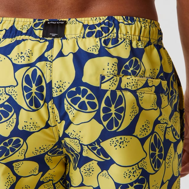 Borg Print Swim Shorts - Stylish and Comfortable Swimwear: Elevate your swimwear collection with the Björn Borg Borg Print Swim Shorts, designed for those who value both style and comfort. Made from 100% recycled polyester, these shorts feature a regular fit with a mid-length design, an elastic waistband with drawstrings for a secure fit, and side pockets for convenience. The standout print adds a touch of flair, making these shorts perfect for the beach or pool. Extra Product Details:. 100% Recycled Polyester Regular Fit with Mid-Length Elastic Waistband with Drawstrings Side Pockets Machine Washable. These swim shorts are the perfect blend of fashion and function, making them ideal for any water activity