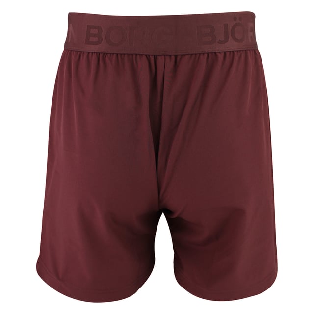 Ace Short Shorts - Sleek and Functional Activewear: Enhance your workout with the Björn Borg Ace Short Shorts, designed for maximum movement and comfort. Made from soft recycled polyester with a hint of stretch, these shorts feature a regular fit with a shorter length, side pockets with a key pocket, and slits on the sides for added mobility. The classic elastic waistband includes a drawstring for easy adjustment, complemented by the iconic tennis-ball logo on the leg. Extra Product Details:. 92% Recycled Polyester, 8% elastane Regular Fit and Short Length Side Pockets with Key Pocket Slits for Extra Movement Machine Washable. These shorts combine sustainability with performance, making them ideal for any sport or workout.