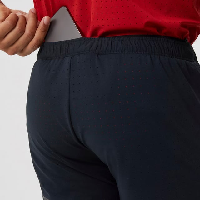 Borg Running Perforated 5" Shorts - Ultimate Breathable Comfort: Elevate your running experience with the Björn Borg Borg Running Perforated 5" Shorts, designed for athletes seeking both performance and comfort. Crafted from lightweight, recycled polyester, these shorts feature perforated fabric for enhanced breathability, ensuring you stay cool during intense workouts. The shorts have a regular fit, a comfortable elastic waistband with a drawstring, and side pockets for convenience. Extra Product details:. 100% Recycled Polyester Regular Fit Perforated Fabric for Breathability Elastic Waistband with Drawstring Side Pockets Machine Washable. These shorts are a perfect blend of functionality and sustainability, making them a great addition to your running gear.