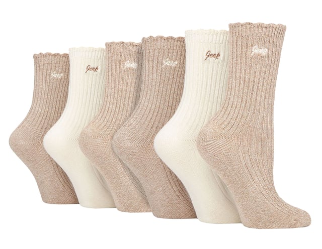 Jeep Ladies 6 Pack Scalloped Cuff Socks: Introducing the Jeep Bamboo Scalloped Top Socks, a delightful triple pack of ladies' socks that exude comfort and elegance. Crafted from an 88% Bamboo, 10% Polyester, and 2% Elastane blend, these socks offer a super-soft and silk-like feel. The fine gauge design features ribbed legs and scalloped edge cuffs for a touch of sophistication. These bamboo socks are not only a treat for the eyes but also a blessing for your feet. Bamboo, known for its gentle nature, suits all skin types, making it a perfect choice for those with sensitivities. The natural properties of bamboo include bacteria and fungal resistance, ensuring freshness throughout wear. Additionally, these socks have superior moisture-absorbing capabilities compared to cotton socks, providing a dry and comfortable feel. Wear these luxurious bamboo socks in any season, as they possess inherent thermoregulating abilities that adapt to changing temperatures. Whether you're donning shoes or boots, these socks promise a great fit and a stylish look. Each pair is elegantly embroidered with a contrasting Jeep logo, completing the perfect trio of colors and comfort. Machine washable at 40°, maintenance is effortless, so you can enjoy the pleasure of these bamboo socks again and again. Treat your feet to the indulgence they deserve with Jeep Bamboo Scalloped Top Socks. Extra Product Details: Delightful ladies' socks with comfort and elegance. 88% Bamboo, 10% Polyester, 2% Elastane blend for a silk-like feel. Gentle on all skin types, perfect for sensitivities. Bacteria and fungal resistant, ensuring lasting freshness. Superior moisture-absorption for a dry, comfortable experience. Inherent thermoregulating abilities for year-round wear. Stylish design with ribbed legs and scalloped cuffs. Effortless maintenance, machine washable at 40°.
