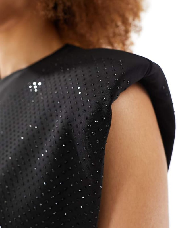 Tops by AllSaints Can't top this Crew neck Padded shoulders Sleeveless style Diamante embellishment Regular fitSold By: Asos