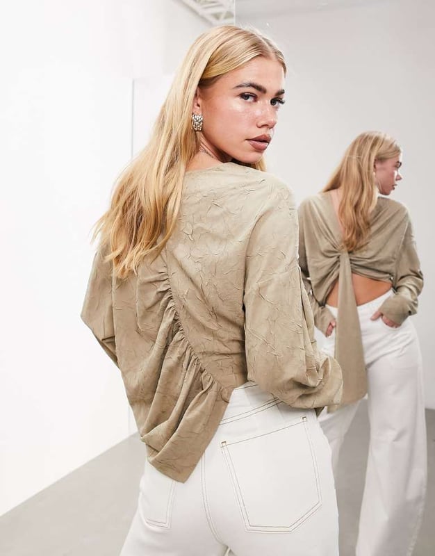 Tops by ASOS EDITION Waist-up dressing V-neck Long sleeves Drape front Ruched back Regular fitSold By: Asos
