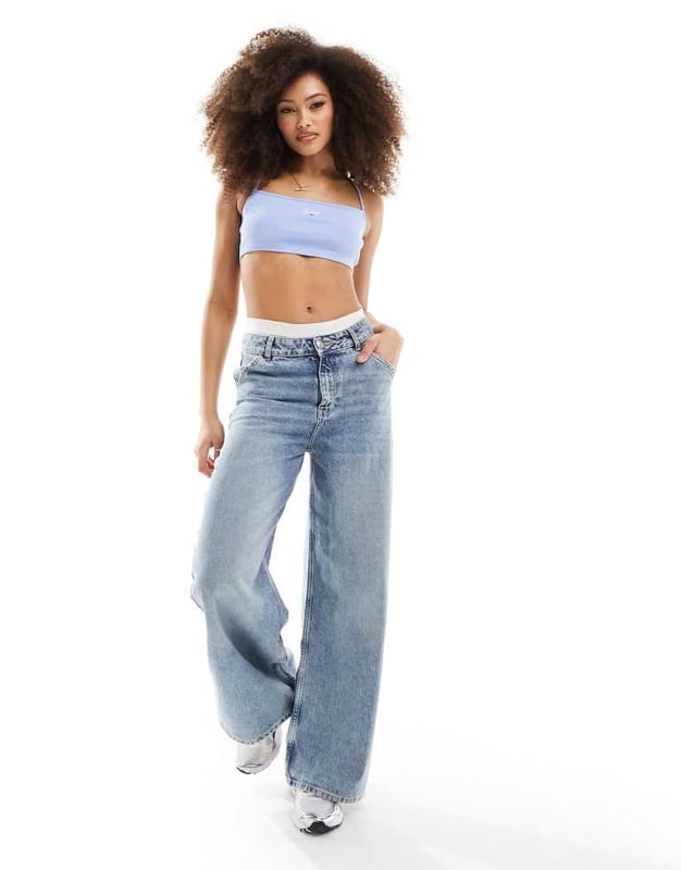Tops by Tommy Jeans Can't top this Halterneck style Logo embroidery Cross-back straps Cropped length Slim fitSold By: Asos