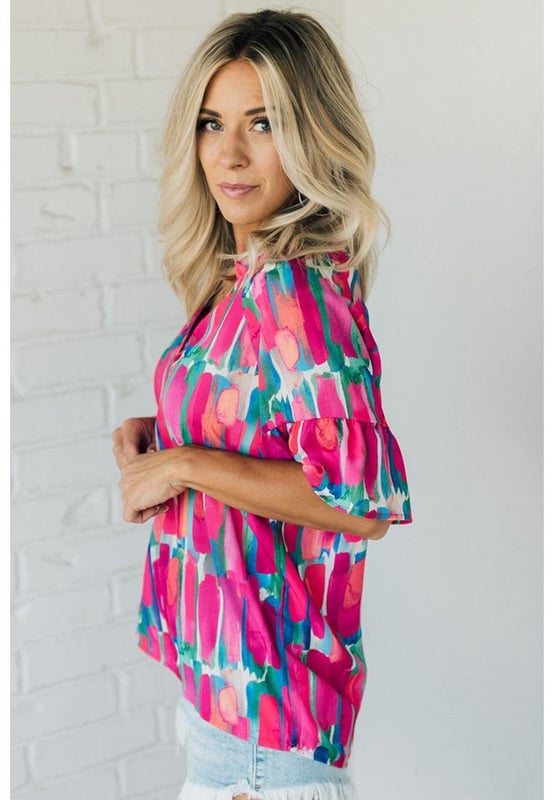 Chic and unique Rose Abstract Brushwork Print
  V
  neck and buttoned detail
  Ruffled sleeves add a touch of grace
  Made of lightweight and soft material
  Comfortable to wear all day long
  Pairs well with pants or skirts
  Popular among different ages
  Please check the size chart below for the perfect fit
