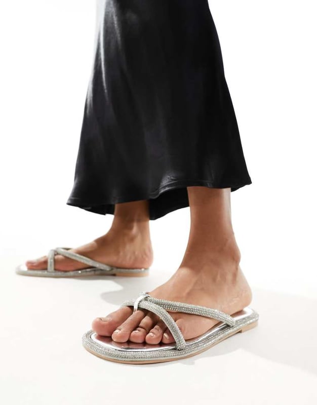 Simmi London Florai strappy flat sandal in silver Shoes by SIMMI Shoes Style with sunshine Strappy design Diamante embellishment Toe post Flat soleSold By: Asos