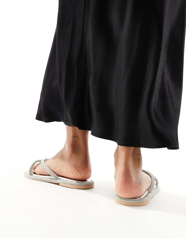 Simmi London Florai strappy flat sandal in silver Shoes by SIMMI Shoes Style with sunshine Strappy design Diamante embellishment Toe post Flat soleSold By: Asos