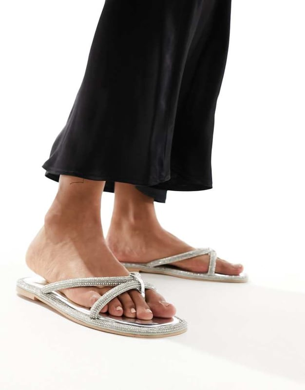 Simmi London Florai strappy flat sandal in silver Shoes by SIMMI Shoes Style with sunshine Strappy design Diamante embellishment Toe post Flat soleSold By: Asos