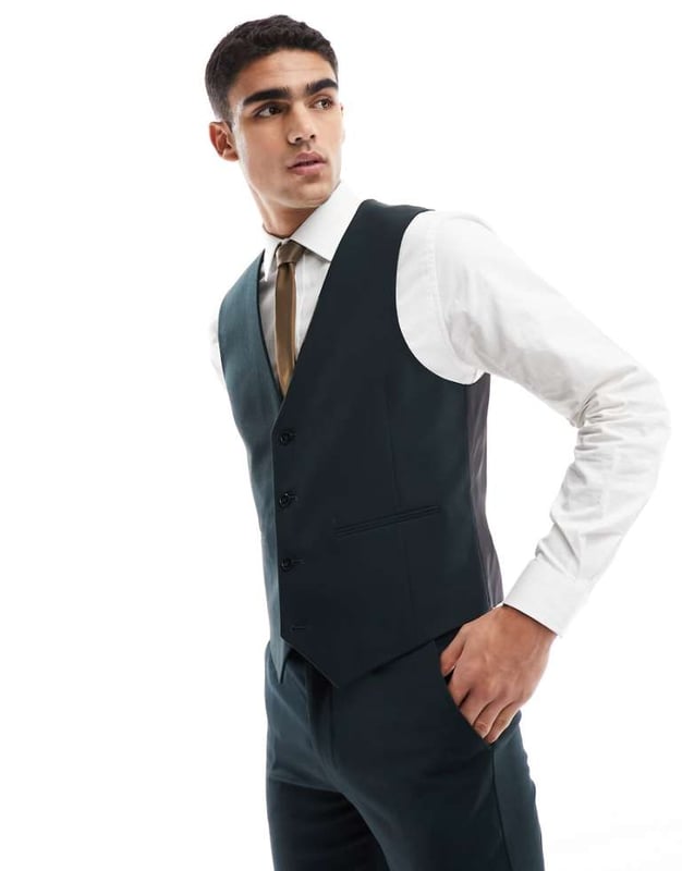 ASOS DESIGN slim suit waistcoat in dark green Suits by ASOS DESIGN Do the smart thing V-neck Button placket Contrast back with an adjustable cinch Slim fitSold By: Asos