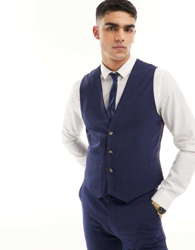 Suits by ASOS DESIGN Do the smart thing V-neck Button placket Pocket details Contrast back with an adjustable cinch Slim fitSold By: Asos