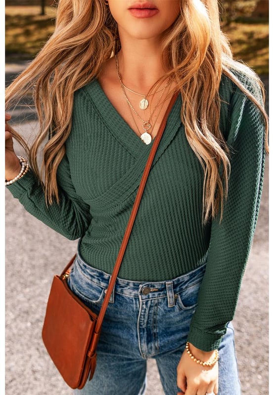 Blackish green waffle knit design
  Slim fit silhouette
  Wrap V
  neck for a touch of elegance
  Comfortable and stretchy fabric
  High elasticity for a perfect fit
  Ideal for day
  to
  night transitions
  Size chart (in inches and centimeters) provided
Material: 60% Cotton 35% Polyester 5% Elastane