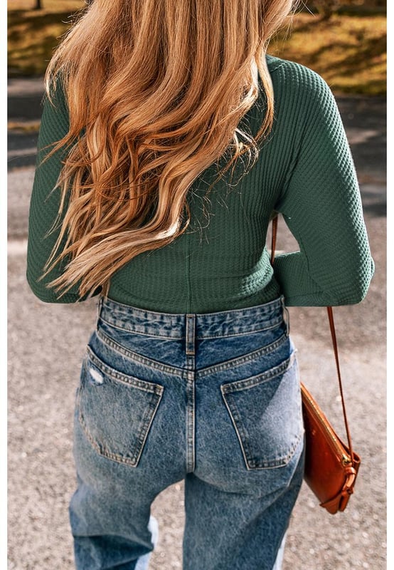 Blackish green waffle knit design
  Slim fit silhouette
  Wrap V
  neck for a touch of elegance
  Comfortable and stretchy fabric
  High elasticity for a perfect fit
  Ideal for day
  to
  night transitions
  Size chart (in inches and centimeters) provided
Material: 60% Cotton 35% Polyester 5% Elastane