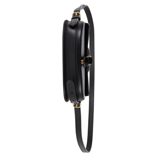 VINTAGE, RRP AS NEW
Timeless elegance in a compact design, the Dior New Dior Bobby Mini Bag in Black Calfskin Leather is a refined take on the classic hobo silhouette. Crafted from luxurious black box calfskin, this mini bag boasts the sophisticated lines and harmonious proportions that define Dior’s iconic style. The antique gold-finish metal details add a vintage charm, while the magnetic clasp with the decorative CD buckle exudes the House’s signature refinement. With a removable and adjustable leather shoulder strap featuring elegant pin buckles, the bag offers versatile styling options – carry it by hand, wear it over your shoulder, or style it crossbody for a laid-back, chic look. Inside, the calfskin and goatskin lining along with an interior slip pocket ensure both beauty and functionality. Whether you're dressing up for an evening out or adding a luxury touch to your day-to-day look, the Dior Bobby Mini Bag is the ultimate accessory for every occasion.



with Box, Dust bag

Dior New Dior Bobby Mini Bag in Black Calfskin Leather
vCondition: Excellent
Signs of wear: No retail tag, No visible sign of wear., 
Packaging: Box, Dust bag
Color: black
Material: Leather | leather
Size: One Size | One Size
Measurements: Width: 170; Height: 100; Length: 170; Handle drop: 0; Strap length: 580
SKU: NAPPUGBBA458696W