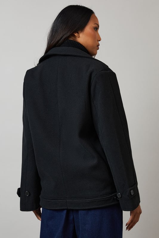 Double-breasted design for a classic, sophisticated look
        Distinctive collar detail adds a touch of elegance
        Versatile woven fabric suitable for various occasions
        Practical button fastenings for easy wear
        Relaxed fit allows for layering and comfort
    
    This Principles Collar Detail Double Breasted Jacket is a versatile piece that seamlessly blends timeless style with modern practicality. The double-breasted design and distinctive collar detail create a polished silhouette, perfect for elevating your casual ensembles. As seen on the model, pair this jacket with a cosy roll-neck jumper and wide-leg trousers for a chic, put-together look. The relaxed fit makes it ideal for layering over knitwear on cooler days, while the woven fabric ensures durability and ease of care. Suitable for a variety of casual events, from family gatherings to weekend outings, this jacket can be styled with both flats and low heels to suit your preference. The neutral hue allows for endless styling possibilities, making it a wardrobe staple that you'll reach for time and time again.