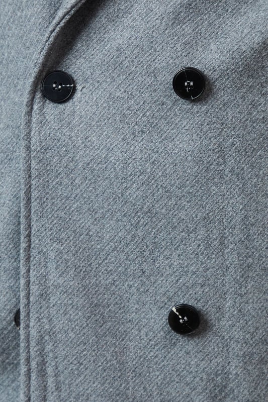 Double-breasted design for a classic, sophisticated look
        Distinctive collar detail adds a touch of elegance
        Versatile woven fabric suitable for various occasions
        Practical button fastenings for easy wear
        Relaxed fit allows for layering and comfort
    
    This Principles Collar Detail Double Breasted Jacket is a versatile piece that seamlessly blends timeless style with modern practicality. The double-breasted design and distinctive collar detail create a polished silhouette, perfect for elevating your casual ensembles. As seen on the model, pair this jacket with a cosy roll-neck jumper and wide-leg trousers for a chic, put-together look. The relaxed fit makes it ideal for layering over knitwear on cooler days, while the woven fabric ensures durability and ease of care. Suitable for a variety of casual events, from family gatherings to weekend outings, this jacket can be styled with both flats and low heels to suit your preference. The neutral hue allows for endless styling possibilities, making it a wardrobe staple that you'll reach for time and time again.