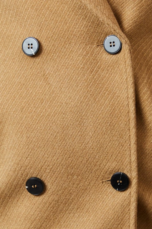 Double-breasted design for a classic, sophisticated look
        Distinctive collar detail adds a touch of elegance
        Versatile woven fabric suitable for various occasions
        Practical button fastenings for easy wear
        Relaxed fit allows for layering and comfort
    
    This Principles Collar Detail Double Breasted Jacket is a versatile piece that seamlessly blends timeless style with modern practicality. The double-breasted design and distinctive collar detail create a polished silhouette, perfect for elevating your casual ensembles. As seen on the model, pair this jacket with a cosy roll-neck jumper and wide-leg trousers for a chic, put-together look. The relaxed fit makes it ideal for layering over knitwear on cooler days, while the woven fabric ensures durability and ease of care. Suitable for a variety of casual events, from family gatherings to weekend outings, this jacket can be styled with both flats and low heels to suit your preference. The neutral hue allows for endless styling possibilities, making it a wardrobe staple that you'll reach for time and time again.