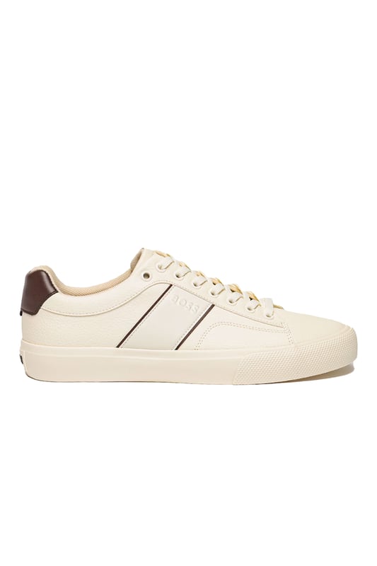 Boss Aiden_tenn_grltp Trainer Natural
100% Leather uppers in a shade of off-white with a contrast Brown heel panel and piping. Subtle embossed BOSS logo sits to the side, these are a timeless pair of trainers that can be easily dressed up or down, integrating effortlessly into any gents wardrboe.

100% Leather Upper
Cupsole construction
Style - 50522833