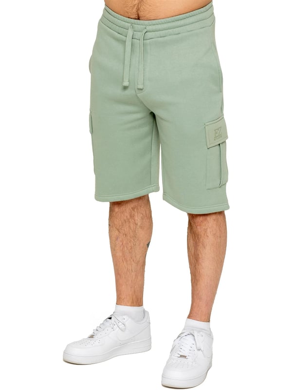 Experience comfort and style with Enzo's Men's Cargo Fleece Shorts. Made with brushed back inner fleece, these shorts offer a regular fit with 2 side pockets and 2 cargo pockets. The elasticated waistband, featuring the EZ logo, is adjustable with a drawstring for the perfect fit.