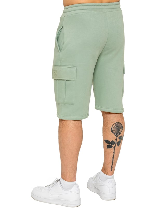 Experience comfort and style with Enzo's Men's Cargo Fleece Shorts. Made with brushed back inner fleece, these shorts offer a regular fit with 2 side pockets and 2 cargo pockets. The elasticated waistband, featuring the EZ logo, is adjustable with a drawstring for the perfect fit.