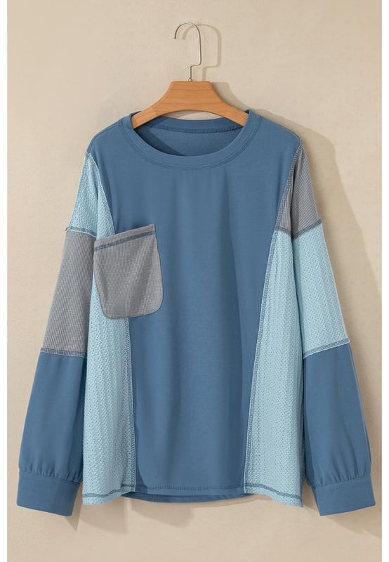Farbe: Dämmerungsblau  
Langärmliges Oberteil  
Offene Nahtdetails  
Farbblockdesign  
Patchwork-Details  
Mit Knöpfen an den Ärmelabschlüssen  
Glatte und anpassbare Passform  
Unisex-Größen verfügbar  
Material: 97% Polyester, 3% Elasthan