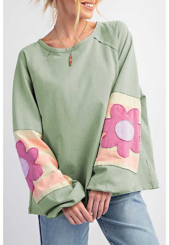 Smoke green flower patchwork design
  Raglan sleeves with elastic cuffs
  Contrasting color stripe pattern on sleeves
  Exposed seams detail
  Raw cut details of the loose fit silhouette
  Friendly to most body shapes
  Available in different sizes
  Unisex
Material: 85% Polyester 10% Cotton 5% Elastane