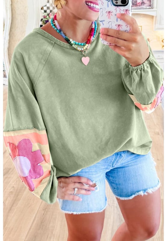 Smoke green flower patchwork design
  Raglan sleeves with elastic cuffs
  Contrasting color stripe pattern on sleeves
  Exposed seams detail
  Raw cut details of the loose fit silhouette
  Friendly to most body shapes
  Available in different sizes
  Unisex
Material: 85% Polyester 10% Cotton 5% Elastane