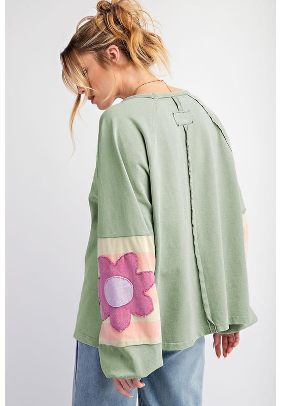 Smoke green flower patchwork design
  Raglan sleeves with elastic cuffs
  Contrasting color stripe pattern on sleeves
  Exposed seams detail
  Raw cut details of the loose fit silhouette
  Friendly to most body shapes
  Available in different sizes
  Unisex
Material: 85% Polyester 10% Cotton 5% Elastane