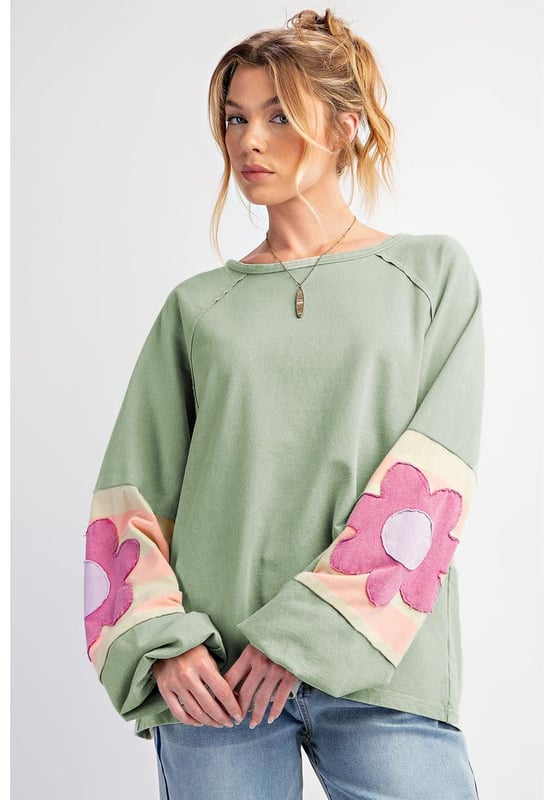 Smoke green flower patchwork design
  Raglan sleeves with elastic cuffs
  Contrasting color stripe pattern on sleeves
  Exposed seams detail
  Raw cut details of the loose fit silhouette
  Friendly to most body shapes
  Available in different sizes
  Unisex
Material: 85% Polyester 10% Cotton 5% Elastane