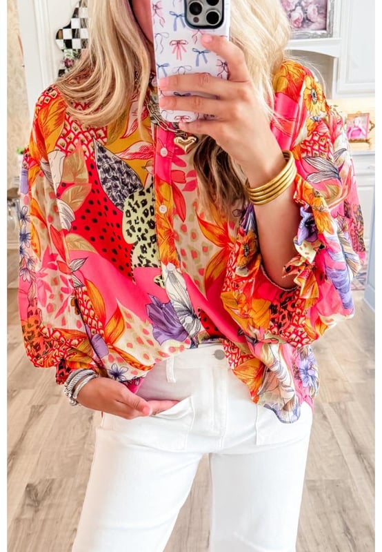 Red Abstract Floral Print
  Buttoned front
  Ruffled bubble sleeves
  Abstract floral print design
  Available in various sizes
Material: 100% Polyester