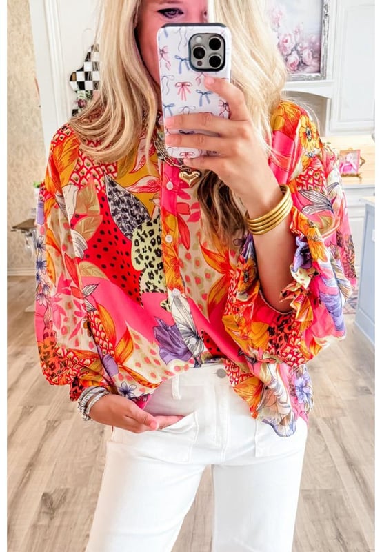 Red Abstract Floral Print
  Buttoned front
  Ruffled bubble sleeves
  Abstract floral print design
  Available in various sizes
Material: 100% Polyester